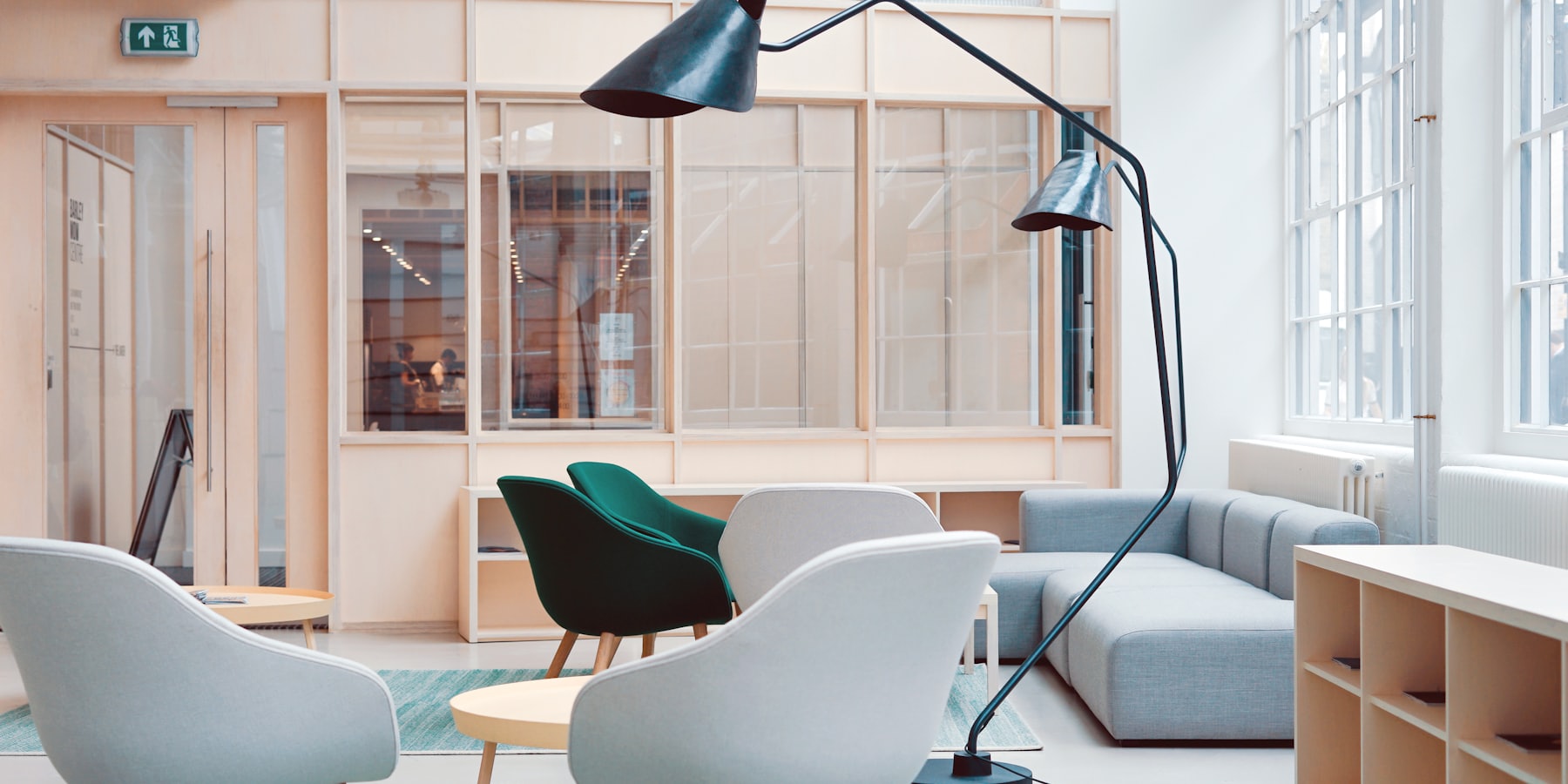 The Meridian lounge, with soft seating, an arc lamp and glazed partitions